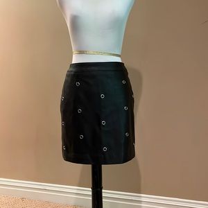 Divided black faux leather skirt with silver ring details